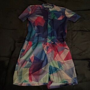 Geometric pink, blue, purple, green men’s medium-sized romper.